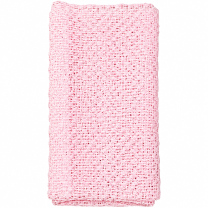 La Serviette 360 exfoliante rose pâle de Jociia, au tissage ouvert et texturé, présentée pliée sur un fond blanc professionnel.